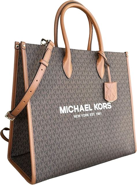 michael kors large pouch|largest michael kors tote.